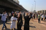 Supporters of Egypt's ousted President Mohammed Morsi chant slogans during clashes with security forces near the largest sit-in by supporters of Morsi in the eastern Nasr City district of Cairo, Egypt, Wednesday, Aug. 14, 2013.