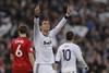 Real Madrid's Cristiano Ronaldo from Portugal celebrates scoring during the Champions League round of 16 first leg soccer match between Real Madrid and Manchester United at the Santiago Bernabeu stadium in Madrid, Wednesday Feb. 13, 2013.