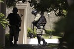 Soldiers guard a street in the area where, according to Mexico's Defense Minister, Mexican drug cartel leader Ignacio Coronel Villareal, aka Nacho Coronel, was killed during an army raid in Zapopan, near Guadalajara, Mexico, Thursday July 29, 2010.