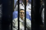 In this Monday, April 15, 2013 file photo, Egypt's deposed President Hosni Mubarak attends a hearing session in his retrial on appeal in Cairo, Egypt. Former Egyptian President Hosni Mubarak was back in court Saturday, May 11, 2013, to hear prosecutors say they are presenting new evidence in his retrial.