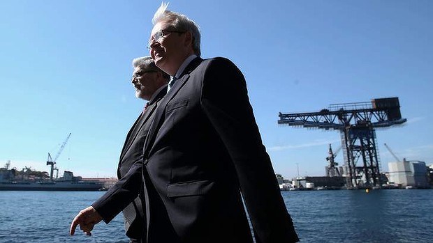 Prime Minister Kevin Rudd and Industry minister Senator Kim Carr at Mrs Macquarie's Chair opposite the Garden Island Naval facility in Sydney.