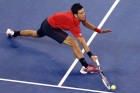 Djokovic of Serbia runs down a forehand against Berankis of Lithuania during their first round match at the U.S. Open tennis championships in New York