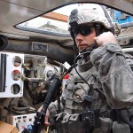 A soldier checks his radio headset in Iraq in 2009. Photo: Army