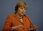 German Chancellor Angela Merkel speaks during a joint news conference with Turkish Prime Minister Recep Tayyip Erdogan, unseen, in Ankara, Turkey, Monday, Feb. 25, 2013. Merkel said Monday Turkey’s European Union accession talks should move forward but dodged a question on whether the Muslim nation would one day become a full member. Merkel was speaking amid a growing frustration in Turkey over the slow-moving membership talks and what Turkish officials say is reluctance by European nations to crackdown on Turkish militants operating in their nations.(AP Photo/Burhan Ozbilici)