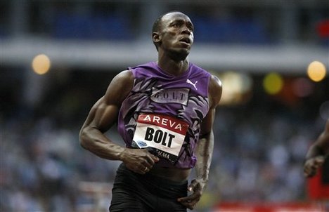 Jamaican sprinter Usain Bolt reacts as he wins in the Men's 100 meters during the Athletics Diamond League Areva meeting at Stade De France in Saint Denis , north of Paris, Friday, July 15, 2010