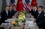 President Barack Obama, left, and Chinese President Xi Jinping, right, meet with their respective delegations at the Annenberg Retreat at Sunnylands on Saturday, June 8, 2013, in Rancho Mirage, Calif., where for two days they discussed high-stakes issues, including cybersecurity, North Korea's nuclear threats, and closer ties between the leaders of the world's largest economies