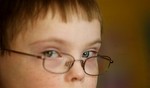 Jacob Moore, 8, takes a music therapy class at his Alpharetta, Ga., home on Friday, Sept. 6, 2008. Jacob has Down syndrome and can read on an 8-year-old level, play the piano, read music and communicate with sign language as well as verbal