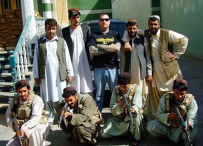 Kenneth Stewart surrounded by Afghans.