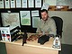 Victorian neo-nazi Kenneth Stewart in his office in Kandahar with an AK-47 rifle and ammunition on his desk.