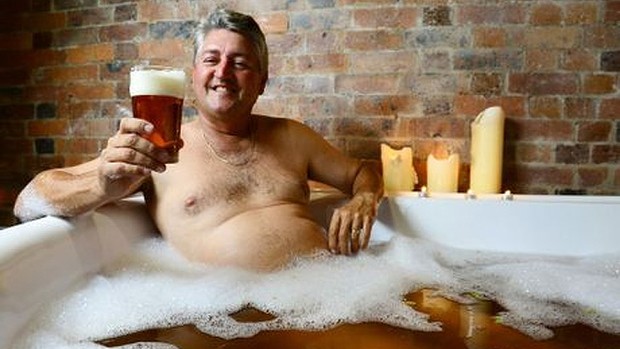 A good day ... David Glinster enjoys a beer - and ale bath - in Ipswich.