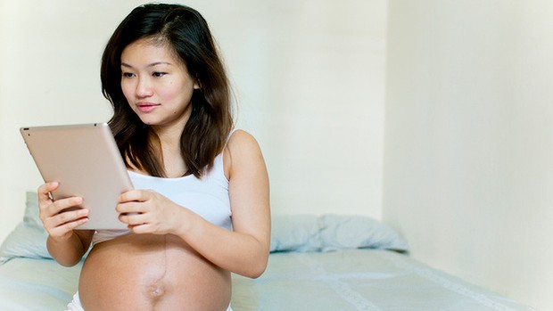 pregnant woman on ipad