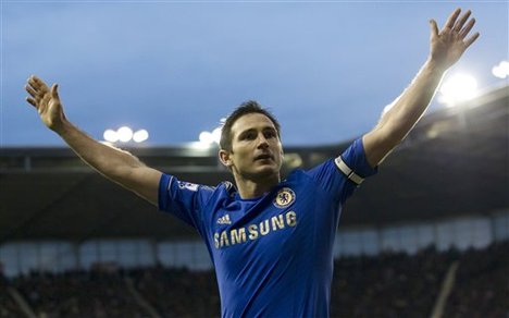 Chelsea's Frank Lampard celebrates after scoring against Stoke during their English Premier League soccer match at the Britannia Stadium, Stoke, England, Saturday Jan. 12, 2013.