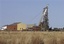 No. 8 Shaft at the St. Helena Gold Mine is seen outside Welkom, South Africa, one of the centers of South Africa's gold mining industry, Wednesday Oct. 10, 2007. Twenty-five bodies have been brought up to the surface at No. 8 Shaft after the illegal miners died from toxic fumes or got caught in a fire 1,500 meters (5,000 feet) underground. South Africa is the world's largest producer of gold and as the bullion price has risen, and legal mines dig ever deeper to meet the world's voracious demand, so have the risks these "gold pirates" are prepared to incur in pursuit of the precious metal. (AP Photo/Peter Dejong)hg3