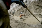 ** ADVANCE FOR SUNDAY, JAN. 11 ** Traditional gold miners use a high-pressure water jet to blast through the soil at a mine in Hampalit, Central Kalimantan, Indonesia, Thursday, April 24, 2008. With the price of gold tripling since 2001, tens of thousands of remote mining sites have sprung up mostly in Asia, Latin America and Africa. (AP Photo/Dita Alangkara)hg3 ** NO ONLN ** NO IONLN **