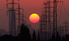 Climate Change And Global Pollution in Israel,  The sun sets behind high-tension power lines, CO2