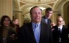 National Economic Council Director-designate Lawrence Summers, center, is pursued by journalists as he walks to a meeting on Capitol Hill, Wednesday, Jan. 14, 2009, in Washington.