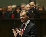 Polish Prime Minister Donald Tusk addresses the Parliament presenting his government program, in Warsaw, Poland, Friday, Nov. 23, 2007. Tusk said Friday his government plans to withdraw Poland's troops from Iraq next year, but will continue its mission in Afghanistan.