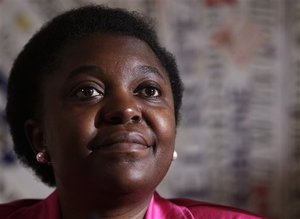 Italian Integration Minister Cecile Kashetu Kyenge listens to a question during a press conference at the Foreign Press Club in Rome, Wednesday, June 19, 2013. Kyenge on Wednesday acknowledged "racist episodes" in Italy but declined to brand the country as a whole racist. She has so far tempered her reaction to racist attacks, saying it's for Italians to respond, not her.