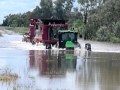 john deere and two case headers swimming