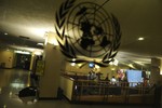 File - A view of the Security Council stakeout area through a glass door, as journalists gather for a briefing by Syrian Permanent Representative to the UN, Bashar Ja'afari, on Syria-Turkey tensions, 4 October, 2012.