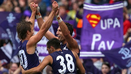 All class: Fremantle star Matthew Pavlich (right) celebrates one of his eight goals against the Eagles yesterday.