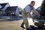 John Waida clears debris from his home from floodwaters in Longmont, Colorado.