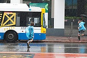  people run for the bus in the in the brisbane CBD. 2nd of March 2013. Photo: harrison Saragossi