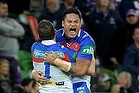 Newcastle Knights players celebrate their victory over the Melbourne Storm