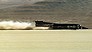 GER07:SPEED:GERLACH,NEVADA,13OCT97 -  Britain's Thrust SSC driven by Andy Green  breaks the sound barrier at Mach 1.007 and becomes the first car to accomplish the feat October 13 on the Black Rock Desert near Gerlach, Nevada.   The Thrust SSC team failed to make a second run within an hour and thus missed setting a supersonic land speed record.    gcc/ Str       REUTERS