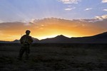 File - A U.S. Army soldier with 3rd Platoon, 87th Sapper Company takes a break during a route clearance mission off of Route 1 in Wardak province, Afghanistan, Aug. 13, 2013.