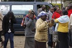 Family members, react, outside the Nairobi City Mortuary in Nairobi mourn the death of loved ones killed in the Westgate attack in Nairobi, Kenya Tuesday, Sept. 24, 2013. Islamic militants who staged a deadly attack on a Kenya mall said Tuesday hostages are still alive and fighters are “still holding their ground,” as Nairobi’s city morgue prepared for the arrival of a large number of bodies of people killed, an official said.