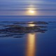 sweden, full moon over stora nassa island group in stockholm archipelago