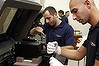 Technicians work on the assembly of 3D printing machines at the Stratasys factory in Rehovot, Israel.