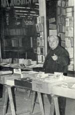 Hem Day tending his bookstore