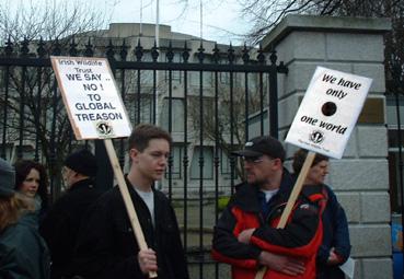 Protestors: We Say No to Global Treason!