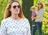 Her little mini-me! Drew Barrymore and her tiny birthday girl Olive, one, wear matching jeans for some sunny fun in Central Park