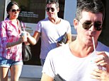 Sharing the sweets: Simon Cowell and his pregnant girlfriend Lauren Silverman split a milkshake from In-N-Out Burger in Los Angeles, California on Sunday