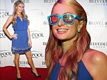 Where's your bikini? Paris Hilton hosts Atlantic City pool party wearing conservative blue key-hole dress