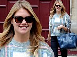 Pin-up girl Kate Upton turns back the fashion clock in retro angora jumper as she hits Paris Fashion Week