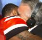 Support: Broadcaster Dom Tiberi is hugged by every member of the Ohio State University football team after he returns to work following the death of his daughter, Maria, who was killed in a car crash