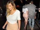 The hourglass figure is back! Kim Kardashian shows off her slimmer waist in a racy PVC pencil skirt and sheer white top for a night out in Paris with Kanye West 