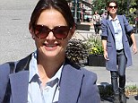 Katie Holmes is riding high in stylish long blue jacket and jeans as she enjoys a girls' day out in the city 