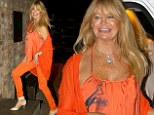 When in Brazil...! Goldie Hawn sports an all-orange outfit as she parties in Rio