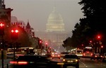 An early morning light fog drifts over the Capitol Building, on Columbus Day, in Washington.