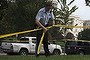 A U.S. Capitol Police officer secures the area with tape after shots were fired outside the U.S. Capitol building in Washington October 3, 2013. The U.S. Capitol was locked down briefly on Thursday after gunshots were fired outside the building following a car chase across central Washington and a number of people including a law enforcement officer were hurt, officials said. A female suspect was killed by police at the scene, a U.S. official said.       REUTERS/James Lawler Duggan   (UNITED STATES - Tags: CRIME LAW POLITICS)