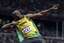 Jamaica's Usain Bolt reacts to his win in the men's 100-meter final during the athletics in the Olympic Stadium at the 2012 Summer Olympics, London, Sunday, Aug. 5, 2012.