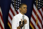 President Barack Obama gestures during his speech in Burlington, Vt., Friday, March 30, 2012, the president was in Vermont on a quick campaign swing that is going to include a series of fundraisers that are expected to draw more than 4,500 people.