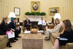 President Barack Obama and Vice President Joe Biden listen as they are updated on the federal government shutdown and the approaching debt ceiling deadline, in the Oval Office, Oct. 1, 2013.