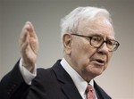 In this May 2, 2009 file photo, Warren Buffett, CEO of Berkshire Hathaway, speaks to a reporter before the annual Berkshire Hathaway shareholders meeting in Omaha