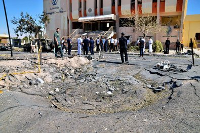 Egyptian security forces at the site of a car bombing on a security headquarters in the Sinai town of El Tur on Monday.